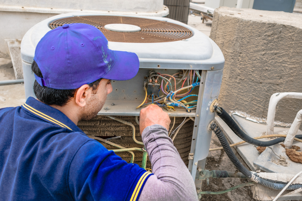 a,professional,electrician,man,is,fixing,the,heavy,unit,of